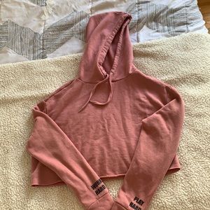 A cropped pink warm hoodie